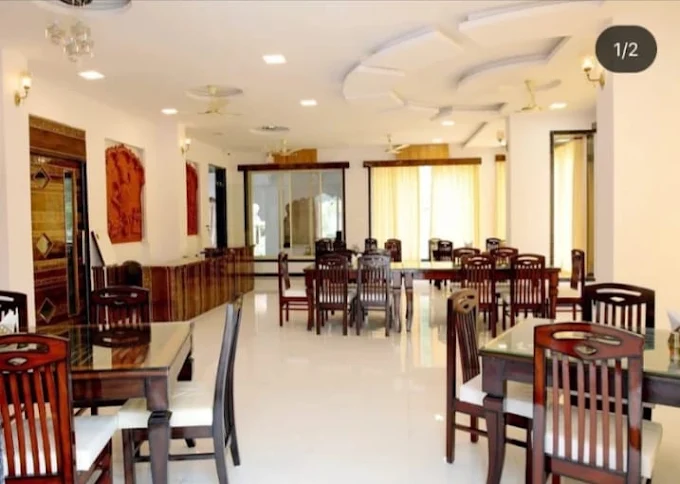 Restaurant seating area with terracotta wall art