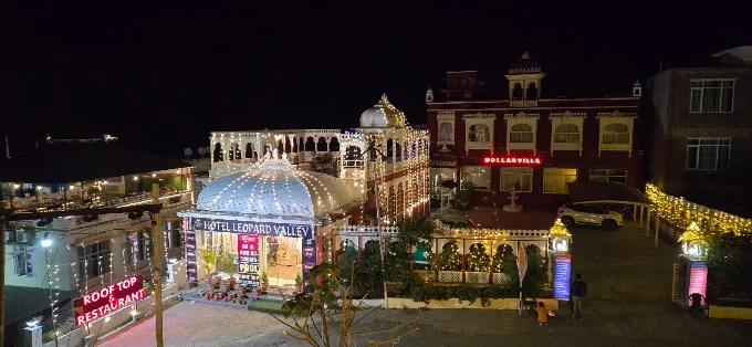 Hotel Leopard Valley Kumbhalgarh illuminated at night, aerial view of the resort and rooftop domes