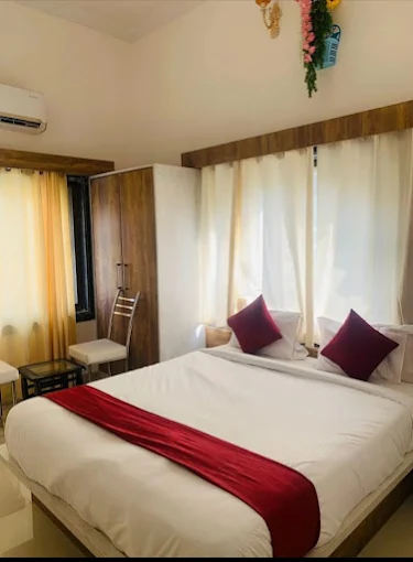 Super Deluxe Room with wooden wardrobe and warm interiors